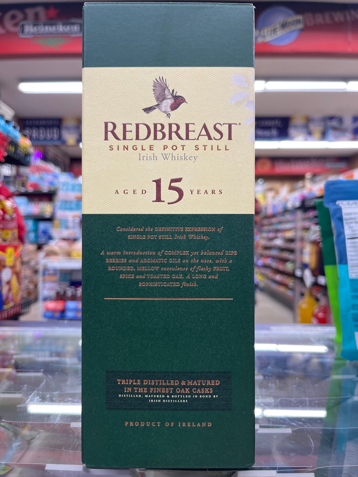 A bottle of Redbreast Irish Whiskey 15yrs 750ml displayed on a shelf.
