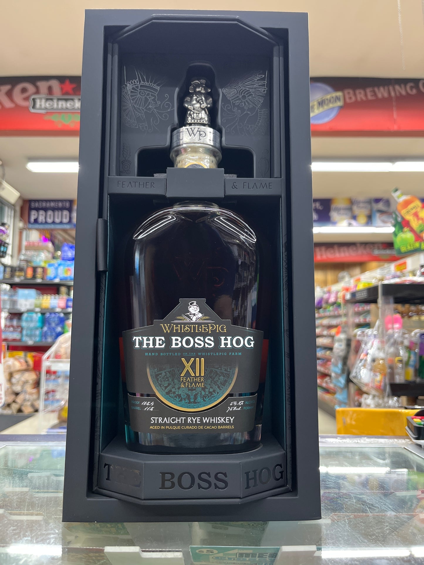 The Boss Hog whiskey XII in a black box with a blurred store background.