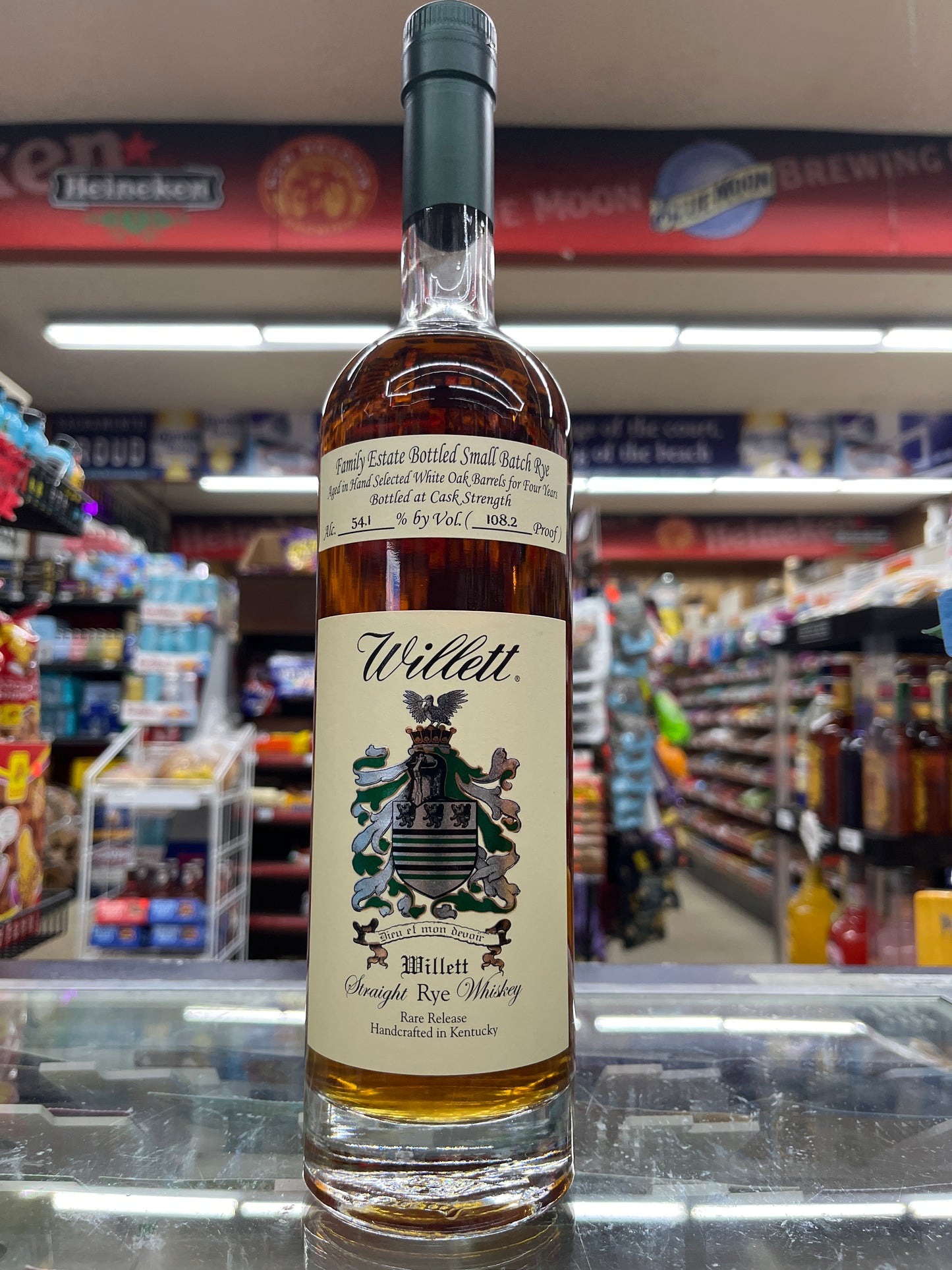 A bottle of Willet Family Estate Rye 4 Years old Cask strength rye whiskey, 750ml, on display in a retail setting.