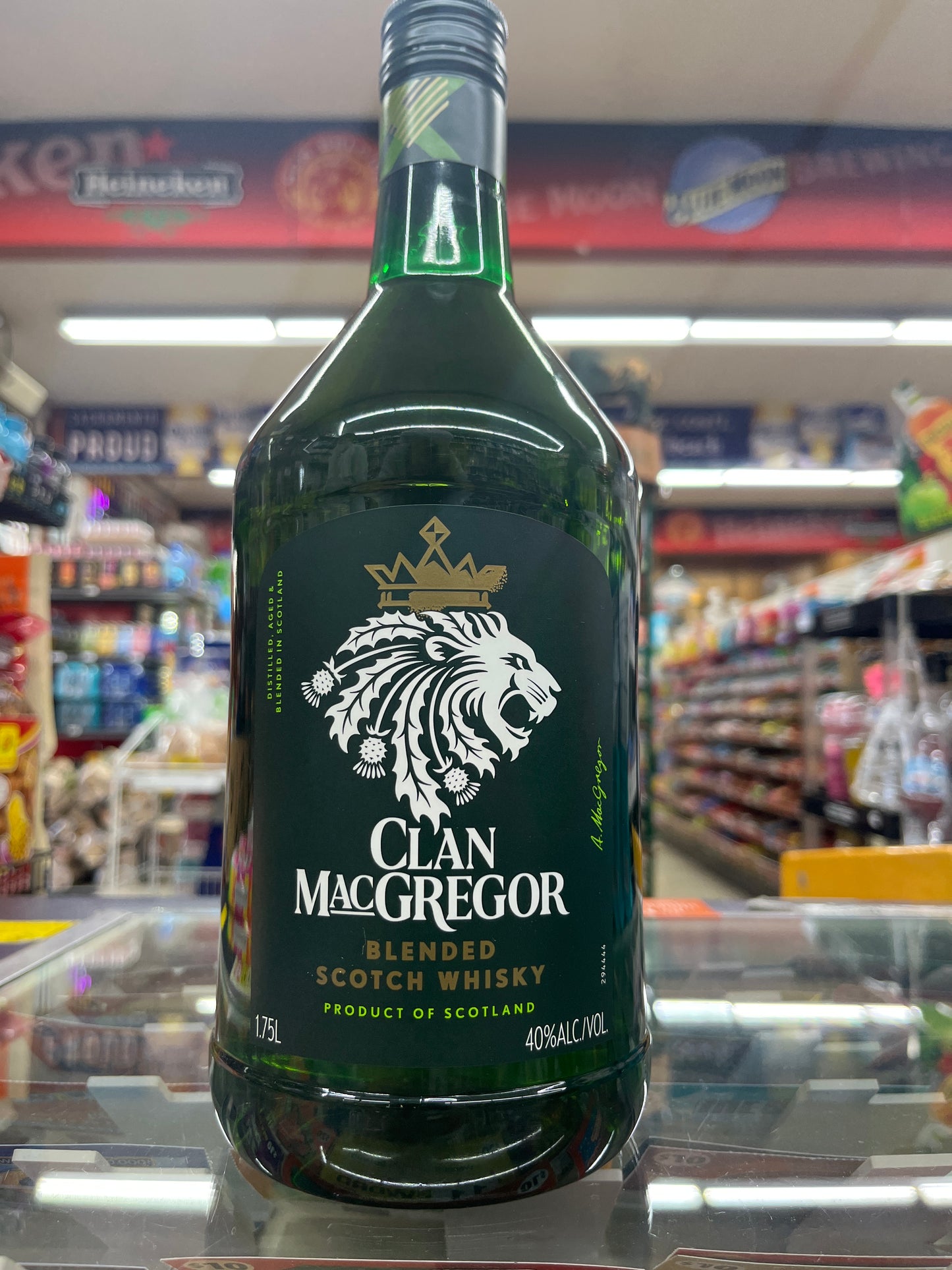 Bottle of Clan MacGregor whiskey 1.75L in a store setting