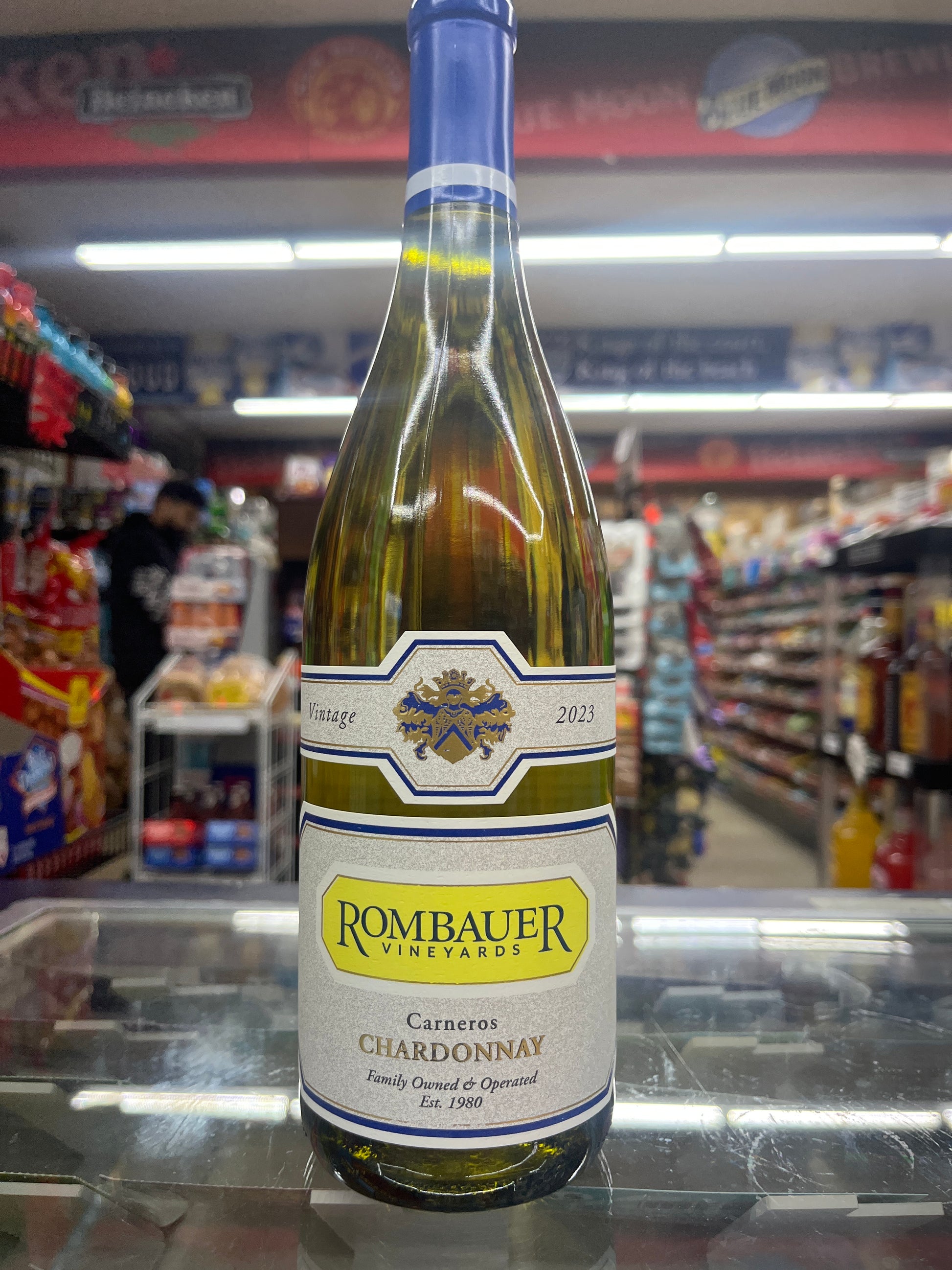 A bottle of Rombauer Vineyards Carneros Chardonnay 750ml wine on display in a retail setting.
