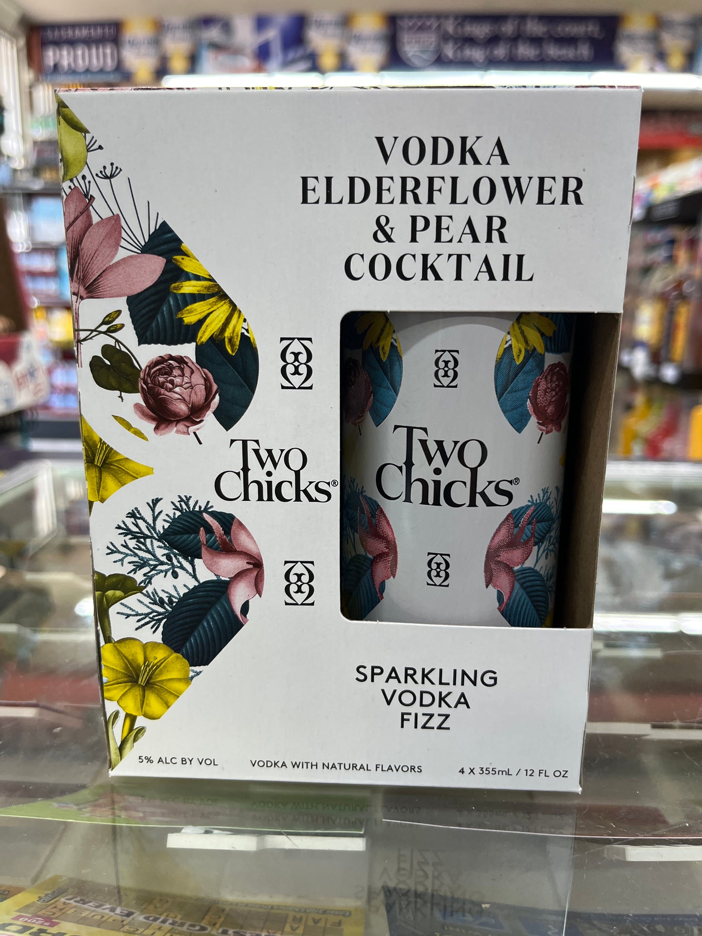 Two Chicks Vodka Elderflower & Pear cocktail packaging on a shelf.