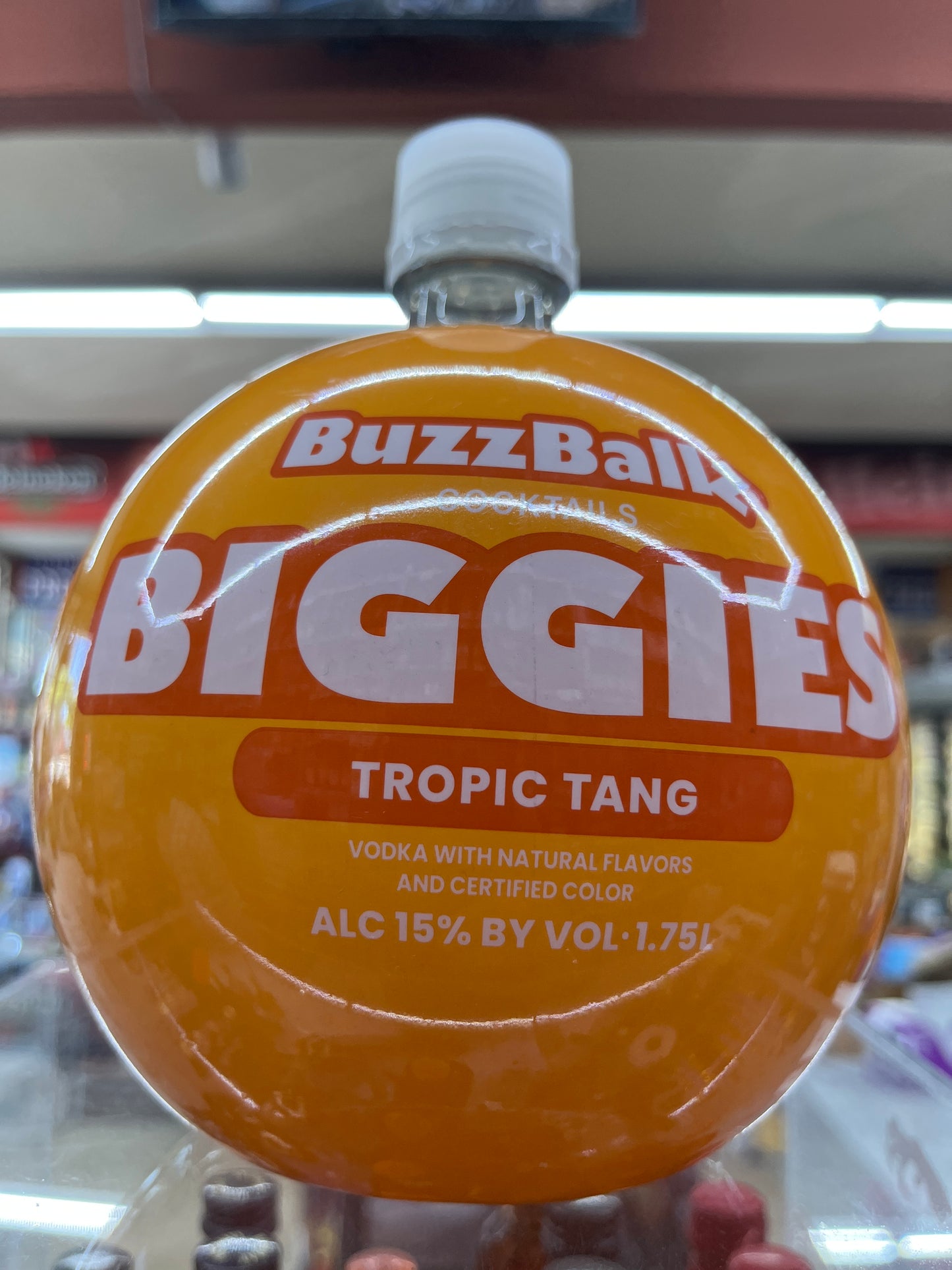 BuzzBallz Biggies Tropic Tang cocktail bottle 1.75L in a store setting