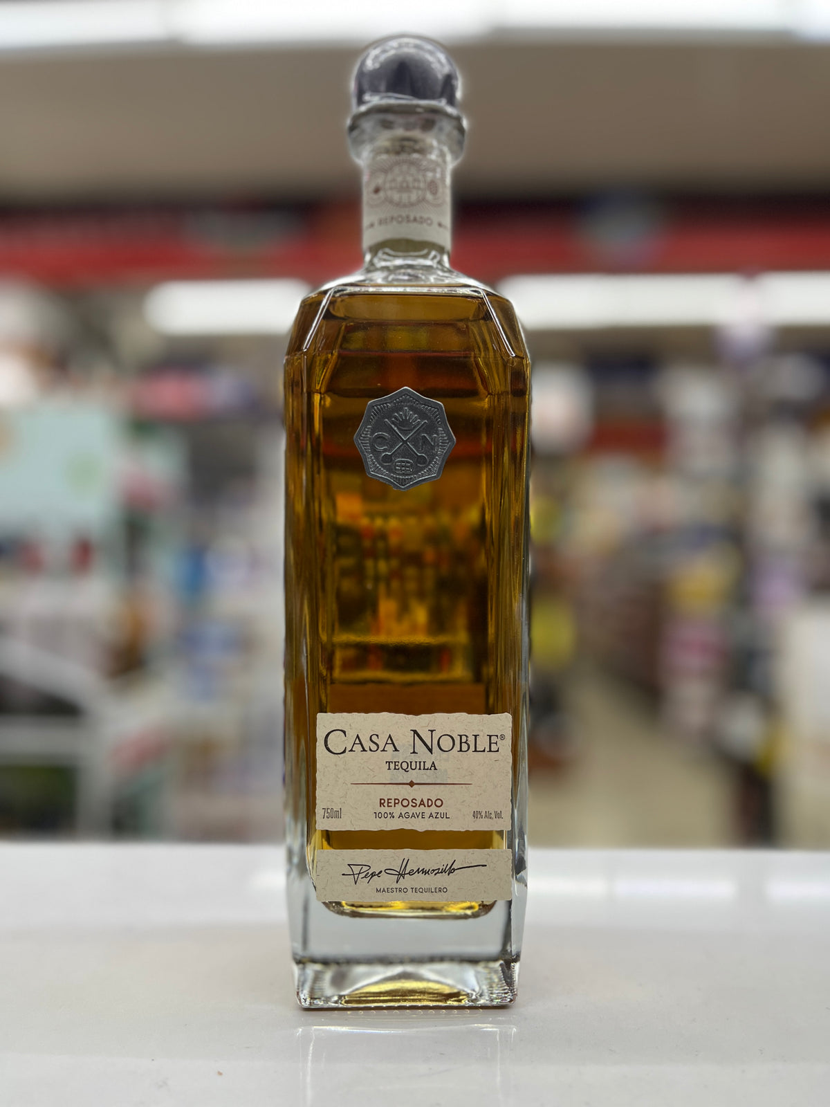 a bottle of Casa Noble Reposado Tequila sitting on a shelf at Metro food and liquor store in Sacramento, California.