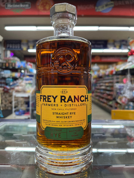 Frey Ranch Rye whiskey bottle with a blurred store shelf background. Made in Fallon, Nevada