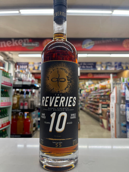 Bottle of Reveries 10-year-old Kentucky Straight Bourbon whiskey held against a store shelf background