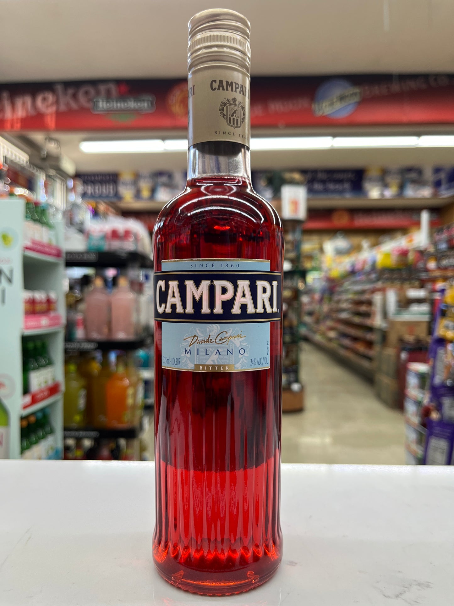 Campari Bottle against a store shelf background