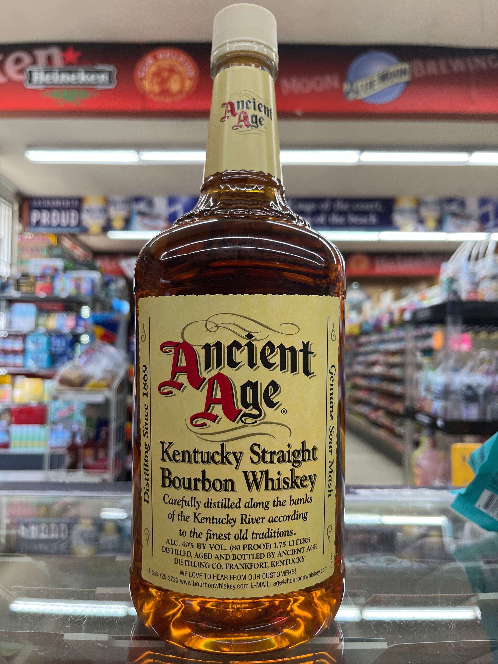 Bottle of Ancient Age Kentucky Straight Bourbon Whiskey on a store shelf.