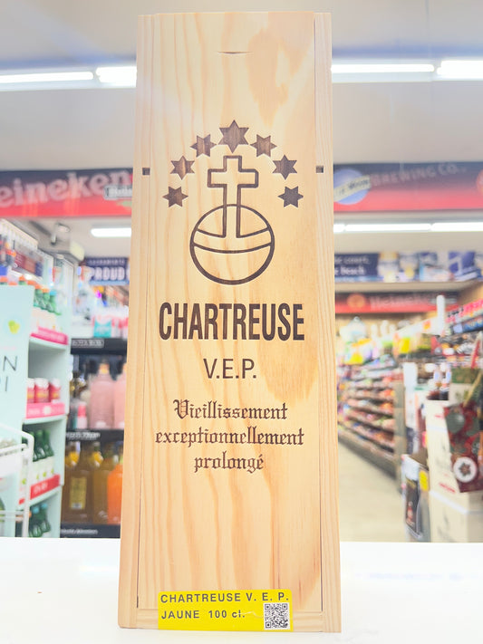 A bottle of yellow Chartruese  VEP in a wooden box