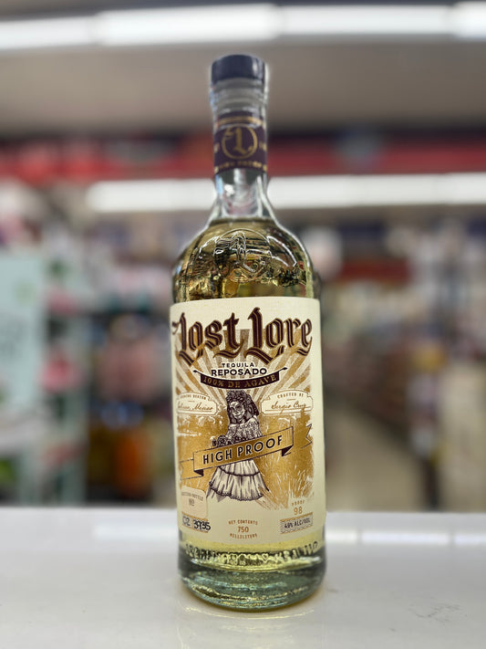 A bottle of Lost Lore Reposado High Proof tequila standing on a white counter in a blurred retail store environment.