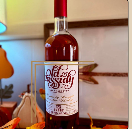 Bottle of Old Cassidy Kentucky straight bourbon by Rare Character whiskey with a decorative frame around it.